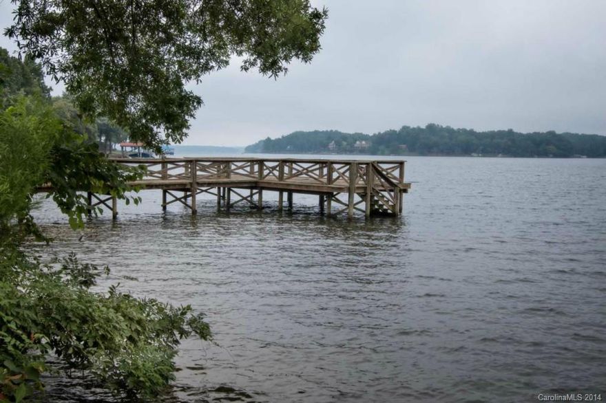 Big open view from this level waterfront lot on the main channel of Lake Wylie!  Located in the excellent Clover school district.  Dock in place, ready for you to enjoy fun on the lake while you're building your new lake house.  Paved roads, great location.  Well and septic required.