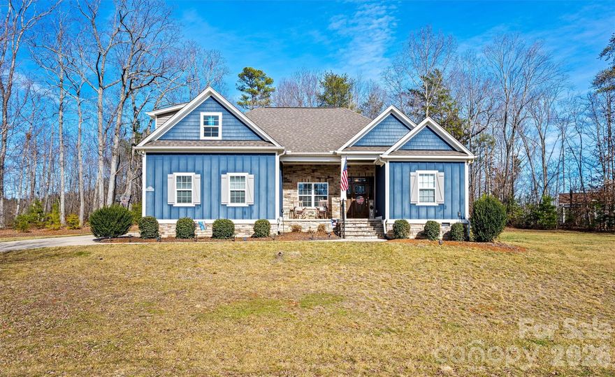 Nestled in the desirable Wynswept Subdivision, this beautifully maintained ranch style home with bonus room offers comfort, style, and privacy. Built in 2017, the home features 3 bedrooms, 3 full bathrooms, and 2419 square feet of well-designed living space. The main floor features an open living area highlighted by an open floorplan, custom cabinets, stunning stacked fireplace, creating a warm and welcoming focal point. Exterior finishes include a tasteful combination of hardboard and vinyl siding accented with stacked veneer stone, adding both durability and curb appeal. Enjoy peaceful outdoor living with a covered front porch and a screened-in back porch overlooking over an acre of land on this wooded lot, perfect for relaxing or entertaining while surrounded by nature. This home blends modern construction with serene surroundings in a sought-after neighborhood.  With Coast proximity to highway 16 this home makes for a quick commute to Hickory or Charlotte.