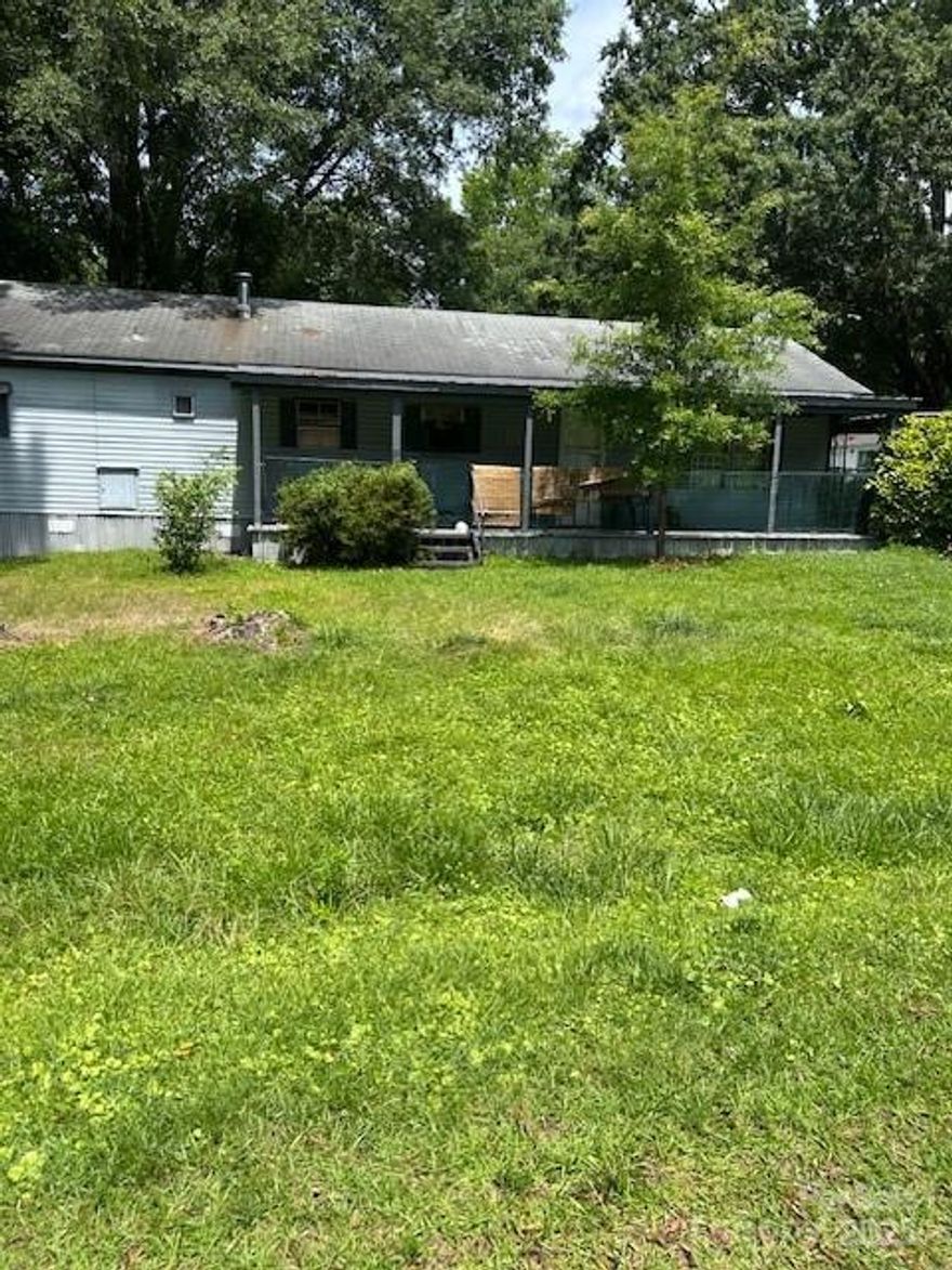 Matthews is HOT ! This is in a prime location just minutes  from 485 exit - close to downtown Matthews where the nightlife and restaurant scene is alive and also close proximity to Independence Blvd for shopping and easy commuting. Property is trashed  beyond repair - inside and outside.Value is in the corner lot only. Look around at all of the new builds and see the potential here .The mobile home zoning provides options for the new owner to either renovate, or remove this home, or to build new construction.NO HOA . In a changing neighborhood with nice new site built houses going up.Connected to community water and public sewer. Please use caution when going into property - SOLD AS IS - seller to make no repairs . VALUE IS IN THE LOT ! This is a Tear down !!!!  Please use caution - property is considered hazardous.