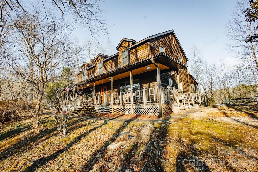 Tucked away on a private, wooded 2.13-acre lot, this charming 1985 cabin-style home offers peaceful living surrounded by nature. Inside, you’ll find warm wood tones and a welcoming layout with a cozy wood-burning fireplace — the perfect spot to gather on cool evenings. Enjoy morning coffee on the porch, afternoons exploring your own wooded acreage, and quiet nights under the stars. The home has been updated with new shingles, soft washed and re-stained siding, new toilets throughout, new back decking, new laminate flooring upstairs, and a crawlspace encapsulation and dehumidifier. This well loved home allows for peace and quiet while still offering the convenience of only 5 minutes to downtown Old Fort, 15 minutes to Marion, and 30 minutes to Asheville.