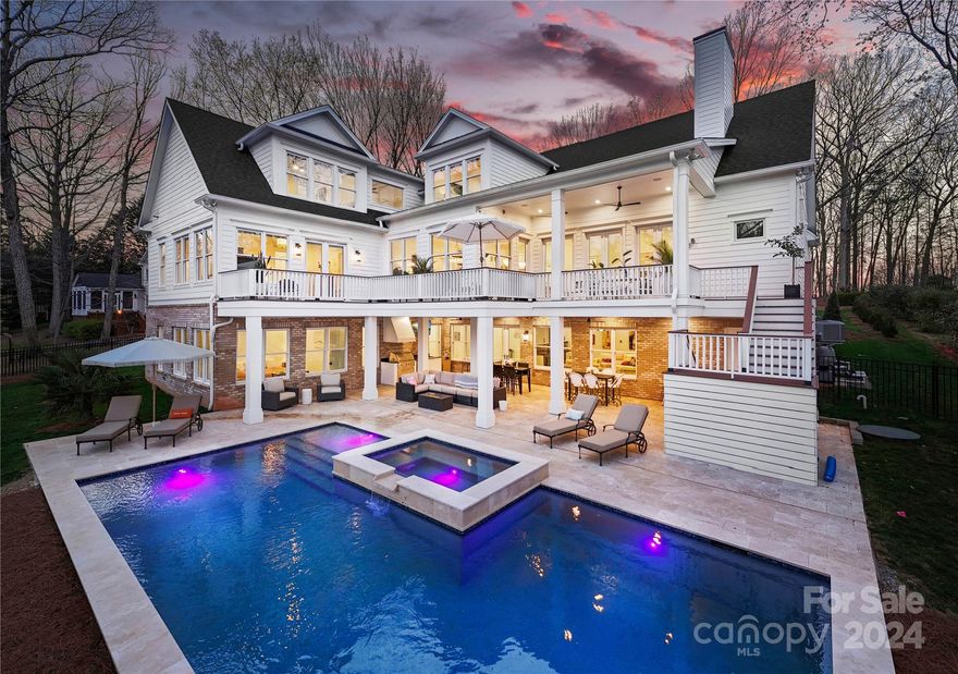 Welcome to luxury living at its finest in the prestigious Patricks Purchase neighborhood of Cornelius! Nestled along the tranquil shores of Lake Norman, on a private and serene cove. Completed in 2023, this exquisite custom-built waterfront residence boasts five ensuite bedrooms and features 12-foot ceilings, along with walls of doors designed to maximize the breathtaking views and provide seamless access to the outdoors. There's ample additional square footage of unfinished space, offering endless possibilities for expansion and customization. Heated pool, hot tub, outdoor kitchen, private dock, and multiple lounging areas provide perfect environment for hosting lavish gatherings or simply enjoying quiet moments of relaxation.

With its unbeatable combination of luxury, comfort, and convenience, this waterfront masterpiece truly offers a lifestyle like no other. Don't miss your chance to make it yours today!