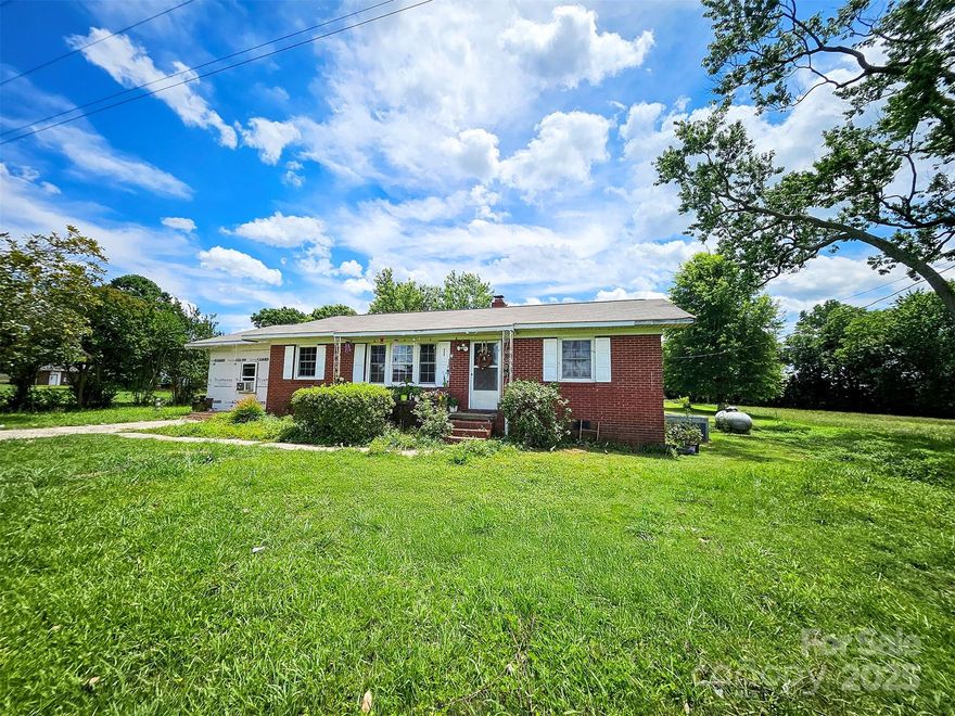 This property features 3 bedrooms, one full bathroom and a half bathroom. This charming property is nestled on a generous 0.8 acres of land, you'll enjoy plenty of outdoor space for gardening, entertaining. New roof installed in 2024, new flooring, septic tank has been recently cleaned out, and the air conditioning system has been maintained.