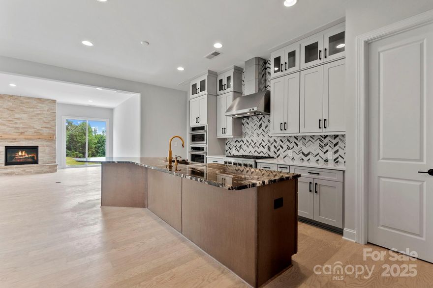 New Construction – Ready Now! Built by America's Most Trusted Homebuilder.  Welcome to the whitmore II at 1074 Sugar Creek Rd in Estates at Sugar Creek. This spacious home invites you in with an open-concept layout that brings together the gathering room, casual dining area, and a uniquely designed kitchen featuring a boomerang-shaped island—perfect for everyday living and entertaining. Just off the foyer, a dedicated dining room adds a touch of elegance for special occasions. Down the hall, you’ll find a second suite ideal for guests or multi-generational living, plus walk-in closets in both secondary bedrooms for added convenience. The owner's suite on the main floor is a true retreat, complete with a roomy bath, dual sinks, a walk-in closet, and a private shower enclosure. Upstairs, the loft offers flexible space for work or play, while the attic suite and unfinished storage area provide even more room to grow. A lengthy 2-car garage ensures you have plenty of space for vehicles and extra storage. MLS#