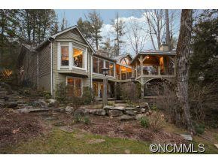 This charming cottage is situated on a beautifully landscaped lakefront lot on a quiet deep-water cove on the main body of Lake Toxaway. The home features three bedrooms, two additional bunk rooms, and four full baths. Upscale finishes throughout with extensive outdoor living spaces that overlook the lake. Look no further for a lakefront cottage on NC's largest private lake!