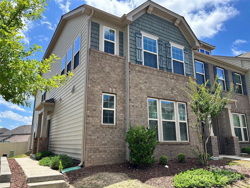 Perfectly situated townhome in Indian Land located in The Greens. This stunning, sun-filled End Unit has 3-bedrooms, 2.5-baths, built in 2020. It is in like-new condition with a FENCED rear yard—primary Bedroom on the main floor and ensuite primary bath with garden tub, separate shower and walk in shower. BRAND-NEW carpet, move right into this neutrally painted, spacious townhome. White kitchen with granite counters, tile backsplash and large center island with pendant lighting. Stainless Steel Appliances include gas range, vented microwave, dishwasher, and french-door refrigerator. Upstairs you will find 2 bedrooms with large hall bath with double sinks. Enjoy the massive loft area for media area or play area. Detached, 1-car garage with parking on driveway and lots of extra street parking for guests. Community has pool and is walkable to restaurants, grocery and some great shopping.