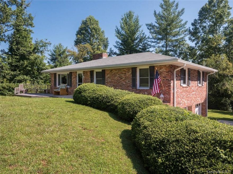 Good bones in this charming brick home in Leicester! You will fall for the warm wood floors, large brick fireplaces, homey kitchen and finished family room downstairs. Many updates, including new bath fitter bathtub, new sink & toilet, three year old deck, newer windows and some interior paint, yet still plenty of room to put your own design stamp as well! This lovely home and almost 3 acres is only 12 miles to Patton Ave. or about 11 miles to Weaverville. Come see this home today!