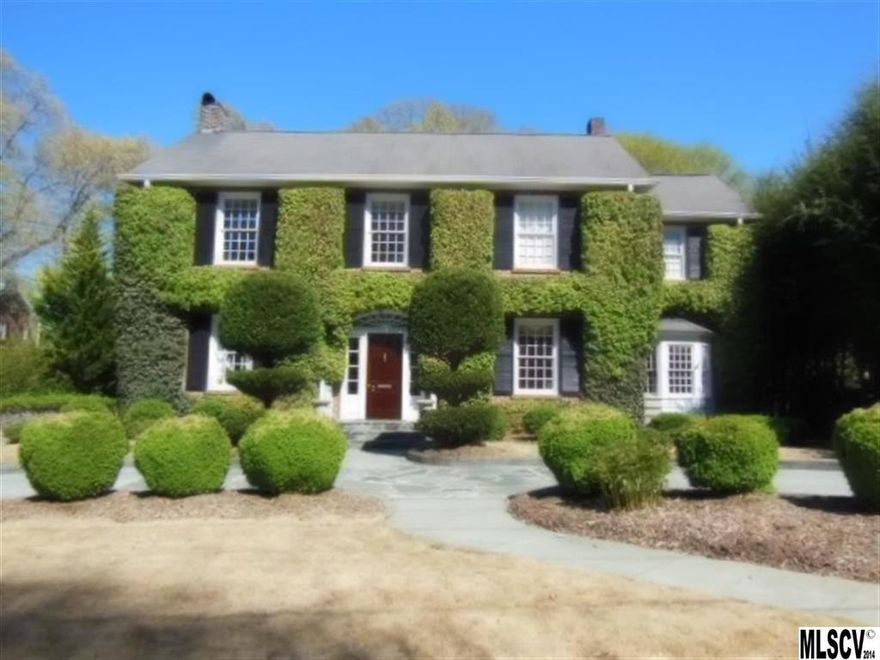 This stately brick 2-story home situated on almost a 1/2 acre street-to-street lot offers updated classic living w/quality thru-out. The main lvl boasts formal LR & DR, a vaulted & beamed ceiling GR, slate floor study/den, cheery kit w/stainless appliances & granite counters, bayed breakfast rm w/built-in cabinets, large butler's pantry & covered outdoor patio w/built-in wood-burning FP, gas grill, refrig & skylights. All BR's are conveniently situated on the 2nd floor w/2 sharing a Jack & Jill BA & all having large closets.The MBR suite includes a sitting area, FP, WIC, & full tile BA w/steam shower, jet tub & dbl sinks. An in suite BA, built-in desk & window seat add to the 3rd BR's charm.The remodeled attic offers a bonus/5th BR w/skylights & full tile BA. Ideal for entertaining & in walking distance to town, the YMCA, Arts Center, school & medical facilities, this landmark home flows beautifully inside & out & boasts 9' ceilings, HDW floors, lovely moldings & tons of personality!