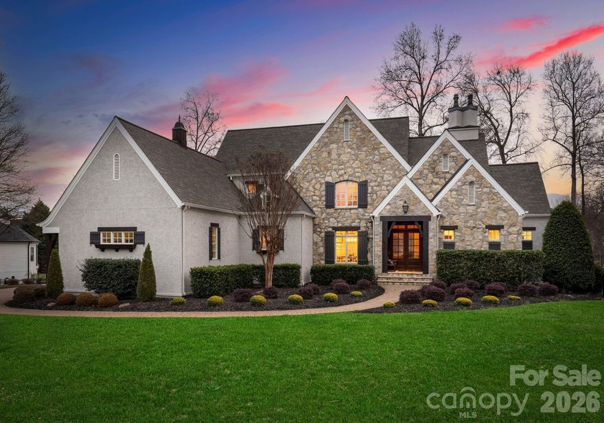 Experience designer luxury in this stunning waterfront retreat on one of the most coveted streets in The Point — welcome to 190 Cape Cod Way. Completely renovated and move-in ready, this 6,300+ sq ft home blends timeless elegance with modern comfort. Every inch reflects exceptional craftsmanship and thoughtful design, showcasing exquisite high-end finishes throughout. The open-concept kitchen flows seamlessly into a cozy family room and a soaring two-story great room—perfect for both entertaining and everyday living. Five spacious bedrooms and 4.5 spa-inspired baths are spread across three beautifully finished levels. A comprehensive renovation includes a new roof (2023), new HVAC systems, tankless water heater, and full remodels of the kitchen and all bathrooms, along with refreshed landscaping, lighting, and a newly resurfaced pool featuring new plaster, stone, and tile. Step outside to your resort-style backyard overlooking Lake Norman complete with a sparkling pool, outdoor grill, sandy beach and covered patios ideal for relaxing and hosting. The walk-out lake level offers a private guest suite, gym, large family room, full kitchen, and theater room. Take a short walk on your backyard boardwalk directly to your boat with a new lift to experience lake living at its finest!