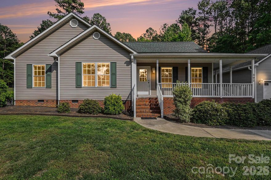 Welcome to Gated Crystal Bay --- a High Rock Lake Community!  This 3 Bedroom 2 full bath 1 level Home is awaiting its new owners!  The huge  24X24 Garage / Shop is perfect for both the  car enthusiasts and hobbyists alike!  Updated kitchen with an abundance of cabinets, new granite, new soft close cabinets and drawers, and lovely ceramic tile backsplash and the refrigerator will convey!  Lovely dining area with extra large set of patio doors for added light that leads to the composite deck for less future upkeep!  The Primary bedroom ensuite highlights an updated bathroom  with a walk-in shower and a wonderful walk-in closet with a custom shelving.  You will find an additional two bedrooms and another full bathroom with all necessary updates to make this gorgeous home truly move-in ready!  Outside you will find a large shed with shelves for extra storage.  An intriguing fire pit area where you can sit and relax and enjoy a beautiful country setting and many tremendous sunsets!  A New Architectural Roof on the home, garage, storage shed will give you a peace of mind as well as a new hot water heater.  Crawl space has been encapsulated with a dehumidifier for added assurance.  Included in your low HOA fees there's a community boat ramp and pier as well as RV/Boat storage area, street lights, gate and road maintenance.  Come see just why you would like to call 392 Cove Wood Drive  YOUR NEW HOME!