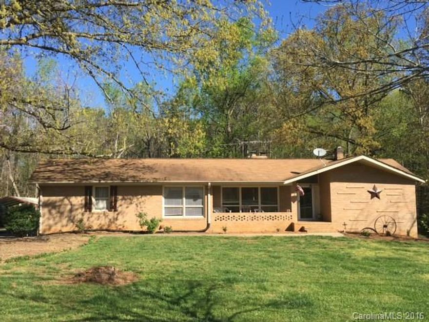 Location.  Wow.  This home has everything you could wish for.  Beautifully landscaped pool and covered 2 story porch.  Separate entrance for potential 2nd living quarters.  Many updates.  Creekside view.  There are any extra storage buildings and a super 3 car shop with storage galore.  Remodeling complete with new kitchen and new flooring and paint throughout.  Close to schools and shopping. Pool liner replace June 2016. Fresh landscaping throughout