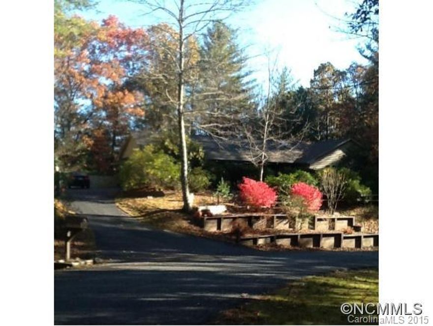 Beautiful custom home on 2+ forested acres. Airy and open, with skylights throughout, vaulted great room with large brick fireplace, spacious remodeled kitchen. Master suite opens onto deck and features remodeled bathroom with new walk-in tiled shower and private study/office. Large double garage with built-in storage, separate carport with studio/office. Professionally landscaped with native plants. Ten min to Heart of Brevard!