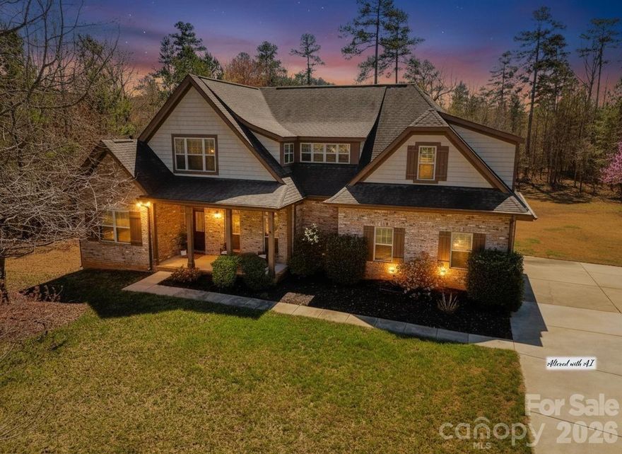 Welcome to your serene retreat, a stunning property that offers the perfect blend of comfort, style, luxury, and convenience, making it an ideal place to call home.  The room overview of this spacious haven features three bedrooms, 2 additional rooms being used as guest rooms, and a bonus room.  Each bedroom has a walk-in closet and full bathroom.  The two upper bedrooms offer a jack a jill style bathroom with separate sinks, sharing the main facilities.  The two extra rooms, one upper and one lower, can be office space, gym area, or playroom, but currently utilized as guest rooms.  

To detail the luxurious primary suite, it boasts beautiful, vaulted ceilings with wood beams, creating an airy atmosphere, and includes a private door leading to the back deck for your morning coffee or evening relaxation. The primary bedroom closet is impressively large, providing ample storage, while the expansive primary bathroom offers plenty of space for your needs.  The walk-in shower and lounge tub both beautiful and oversized.   

Taking you back to the entry way, as you enter the home, you’ll be greeted by a stunning foyer / entryway that showcases the windows in the living area that go to the ceiling, allowing for captivating views and an abundance of natural light. The grand stone fireplace adds a beautiful centerpiece to the living area, complemented by the elegant wood beam ceilings. The gourmet kitchen is equipped with granite countertops and custom-built cabinetry, a bar area for entertaining or eating on the go, truly perfect for culinary enthusiasts.  There is a formal dining area space.  The laundry room has it's own space on the main level and near the garage entry where a two-car garage awaits and used for secure parking or some even see additional storage.  

This home is not only a secluded oasis but also conveniently located within a 10-mile radius of fantastic amenities, including parks and recreation, Shopping, Restaurants and cafes, Cultural venues, Schools and education institutions, Healthcare facilities, and Golf.  Veronet Vineyards for local wine tasting, Patriots Park for outdoor activities and family outings, Joy Theatre for entertainment, and Charlotte Douglas International Airport for easy travel. Don’t miss the opportunity to make this secluded haven your forever home—schedule a viewing today and experience the perfect blend of luxury, comfort, and convenience!