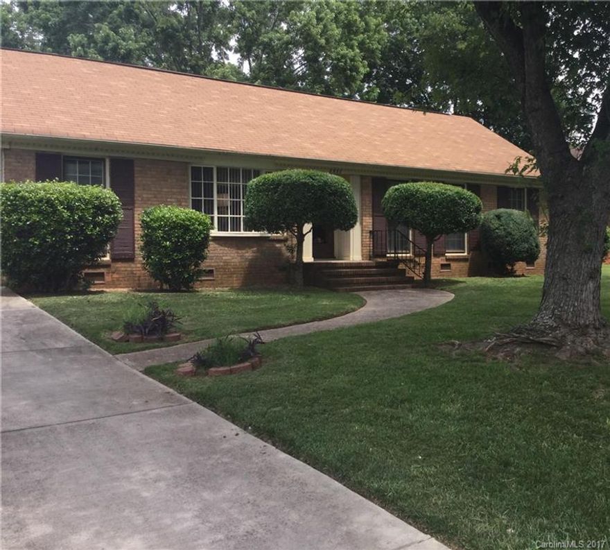 Beautiful Brick Ranch Style Home. 3 Bedrooms, 2 Full Bathroom, Formal Dining Rm, Living Rm, Original Solid Wood Floors throughout the home, Family Rm that invites you into a Screened Entertaining Outdoor Patio, Laundry Rm, Large Fenced in Yard, Manicured Landscape, Carport, Storage Room, .  Nestled in a quiet sought after tree lined neighborhood.  15mins from Uptown Chlt. 10mins from I85 University Area. Seasoned neighborhood with NO HOA Fees. A place you want to call HOME!