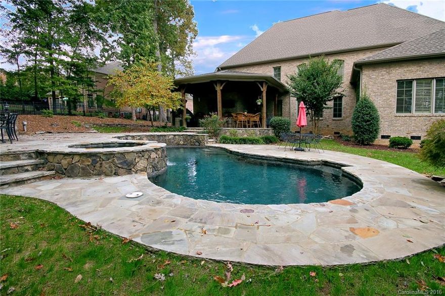 Elegant home in Gated Providence Downs South. A Stunning Foyer leads to one of the Finest Homes in PDS. Gorgeous Hardwood floors, Plantation Shutters, Gourmet Kitchen and Luxurious Master suite to mention a few of the fine features.  Coffered ceiling adorns the finely appointed Office. The outdoor amenities are second to none- Gunite Pool and Spa, Outdoor Kitchen/bar, Covered Patio, smoker and Fireplace and gorgeous stone flooring.  This home was under contract for over 975k and it appraised!