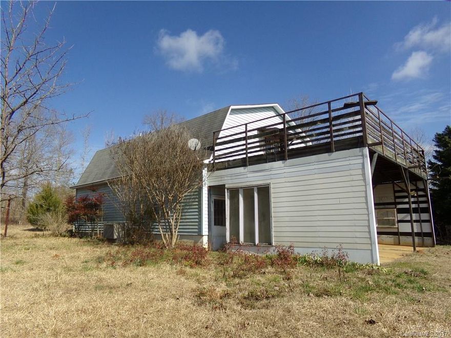 Make this your weekend get away or future home site! It features a large storage/shop building, former living quarters with storage and balcony deck.  There is plenty of paved road frontage and lots of room to roam on this rural property located between Pageland and Chesterfield.