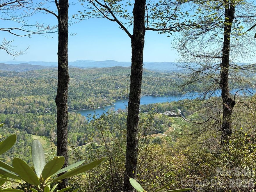 STOP. IMAGINE.... You step onto the deck just as the first light gathers behind the Blue Ridge. The air is cool and clean, carrying the scent of mountain laurel and damp earth. Below, the lake rests like glass reflecting the sky's shifting colors. A veil of mist lingering in the valley. As the sun crests the ridgeline, it spills across the landscape - the water, the hills, the winding roads - bringing warmth and color. And in that moment, you realize this isn't just a view, it's your home.

This nearly 5-acre homesite is priced to move. It has long-range, year-round, easterly views of the WNC mountains, Lake Toxaway, and the beautiful golf course below. Don't miss this opportunity to build your dream home on an amazing piece of property in WNC.