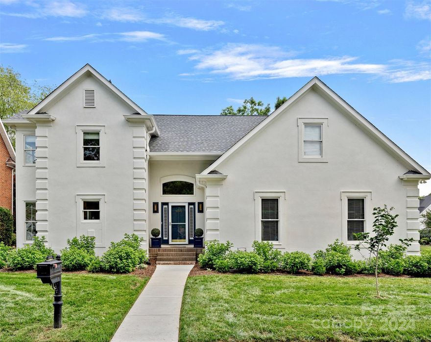 Pristine Lakeview beauty nestled conveniently near the southern shores of Lake Norman. Elegant white exterior surrounds the open light-filled rooms within. The incredible cook's kitchen (2022) has honed quartzite countertops, two ovens (one with steam!) a dinette, designer lighting+custom white cabinetry. The dining/living areas are oversized+enhanced by high-end window treatments and hardwood floors newly refinished in the perfect color. Awake in the large main level primary suite complete with walk-in shower/free-standing tub. Relax in the vaulted screened porch, or warm up in the colder months by the fireplace. Find flexible living options w/5 bedrooms (2 Downstairs!) 4.5 baths + theater room. Take a short walk to your assigned BOAT SLIP. Or visit community: lakeside pool, dock or tennis court. Find rest in the low maintenance luxury of an HOA tended lawn as well as benefit from numerous updates such as(2023)new driveway, water heater, garage door, EV charging circuit. Roof(2020).