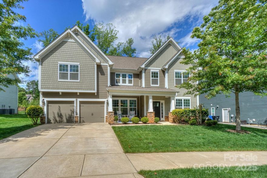 The perfect floor plan of this home allows for an easy flow of entertaining guests or family fun. The size will surprise you! Large chef's kitchen to help you serve up great meals, with double ovens, gorgeous island, big pantry, and buffet bar extra storage. The extra features in this home will surely bring a smile to your face, including a 2-story foyer, 5" hardwood floors, deluxe moldings, coffered ceiling in dining room, a bedroom and full bath on the main floor, and an office with French doors. Upstairs, the expansive Primary Bedroom includes a tray ceiling, adjoining sitting room, large bath, and three closets. This stunning home offers a Lake Norman community lifestyle, including a waterfront boardwalk, gazebo, water access; community clubhouse and pool! Tesla charger included. Covered patio, and extended stone patio with firepit; fully irrigated yard adjoins the paved nature trail. Close to schools and shopping/dining. Some photos virtually staged. Schedule an appointment today!
