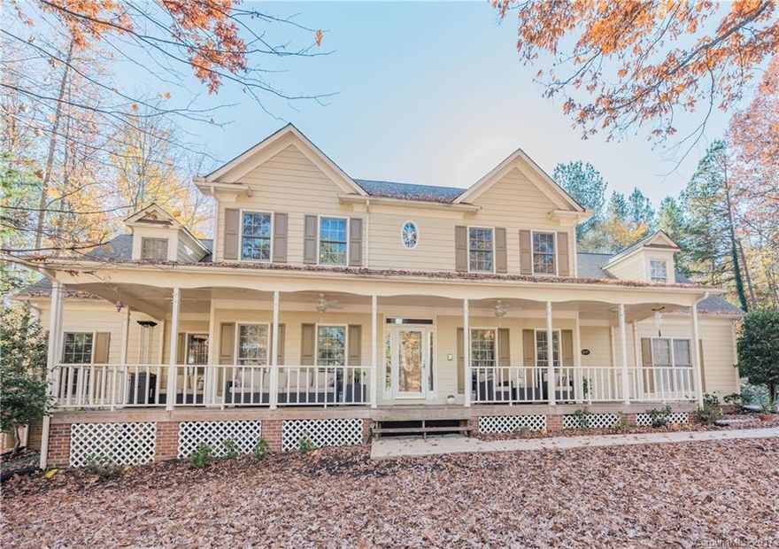 Gorgeous front porch spans the entire length of this beautiful 2 story home sitting on 1.3 acres. Two Master  Suites, one on main level and other on upper level. Formal areas.  Kitchen w/ honed granite counter tops and SS appliances.  Great room w/ wood burning fireplace. Drop zone w/ brick flooring.  Two stair cases.  Large secondary bedrooms.  Bonus room with second laundry.  Oversized garage w/ 2 storage areas. Fenced back yard. Great schools. Walk to shopping. Fabulous location in Fort Mill!