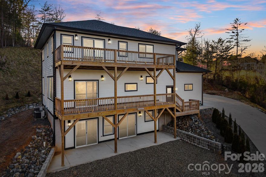 Mountain views. Modern design. 1.43 acres. And now priced at $830,000.
Built in 2025, this 4BR/3.5BA home in Hawks Cove blends clean contemporary lines with warm Arts & Crafts finishes. The open-concept main level features a chef’s kitchen, walk-in pantry, gas fireplace, and expansive windows that frame the Blue Ridge backdrop.
The primary suite offers a spa-like bath with soaking tub and generous walk-in closet. Downstairs, the finished walk-out basement creates flexible space for guests, multigenerational living, or income potential.
With over 3,100 sq ft, mountain views, and room to breathe—this is one of the best values in North Buncombe.
Minutes to downtown Weaverville. Easy access to Asheville. Move-in ready.