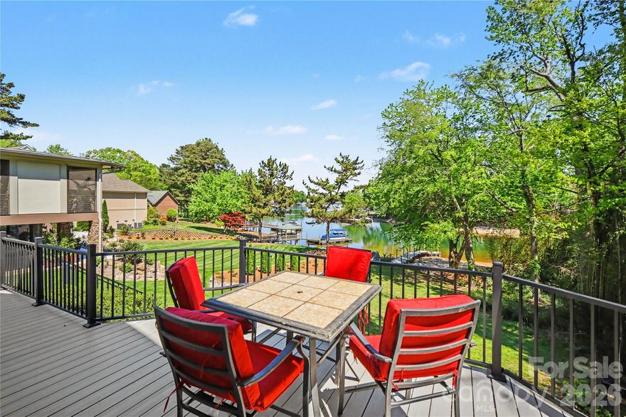 WATERFRONT IN CORNELIUS! Fully remodeled with designer finishes throughout, this private oasis offers water views from nearly every room. 

You've earned it — relax on the backyard deck overlooking the lake and marina. Enjoy 46' of water frontage, a private dock, a sandy beach, and access to the community boat ramp and dock. Expansive windows fill the main living areas with natural light, creating an airy, vacation-like feel. 

The main-level primary suite offers water views, privacy, and convenient access to living areas. The elegant ensuite bath with upscale features makes every day a spa day, while dual closets provide ample storage. The chef’s kitchen boasts a 48" range/double oven, perfect for entertaining or everyday meals. Excellent flow between the kitchen, living room, dining room, and expansive deck makes hosting a breeze. Upstairs, three secondary bedrooms offer flexibility — ideal for a home office, gym, or hobby space.