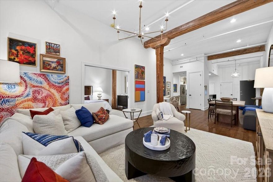 The finest home in South End! Chic, Historic, and Exceptionally Rare — A True South End Gem! Welcome to an extraordinary, designer-renovated residence in Factory Lofts, one of Charlotte’s most iconic and coveted buildings—formerly the historic Lance Cracker Factory and now home to just 50 exclusive residences. Set in the heart of South End, Charlotte’s hottest and most dynamic neighborhood, this home blends industrial heritage with refined, designer-level sophistication. This true one-bedroom home was gut-renovated by an internationally known interior designer as her personal residence, resulting in a level of craftsmanship and finish rarely seen in the market. Soaring 15' ceilings, refinished hardwood floors, a stunning leathered quartz waterfall island in the kitchen, and a spa-like bathroom set a timeless, elevated tone throughout. Thoughtfully designed custom closets maximize storage, while curated lighting by Visual Comfort adds warmth and architectural drama. The loft-like layout offers exceptional versatility—perfect as a primary residence, pied-à-terre, or income-producing investment. Even more rare, Factory Lofts is one of Charlotte’s only true LIVE/WORK buildings, allowing you to operate a boutique business, studio, or office directly from the unit. Additional highlights include gated parking, a SEPARATE STORAGE ROOM, and abundant original factory details that celebrate the building’s historic character. Stylish, flexible, and truly one of a kind—this is South End living at its finest.