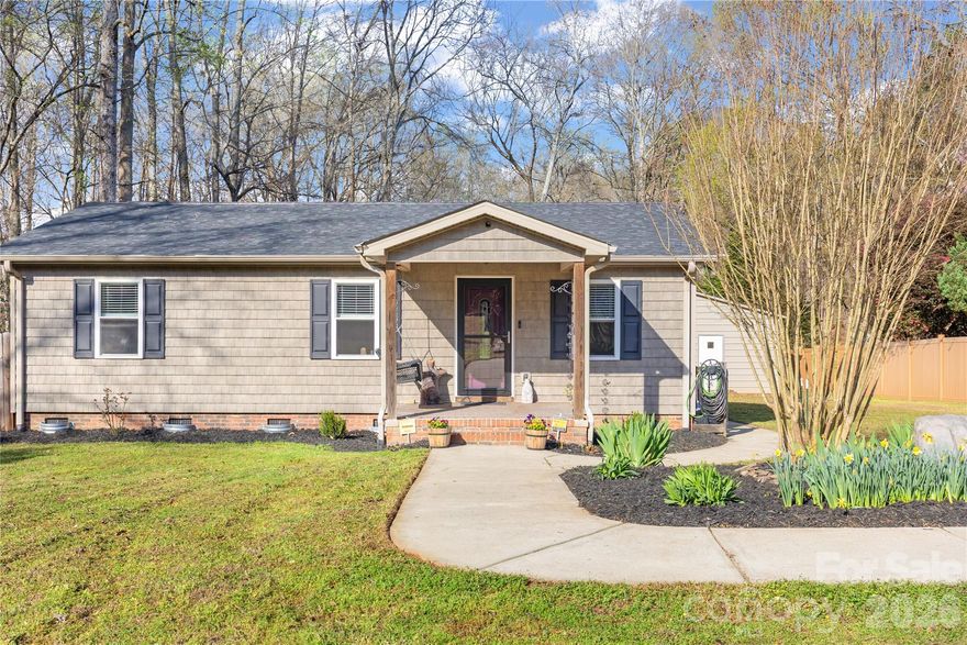 Fabulous Location in award winning Fort Mill School District!! One mile from medical offices, shopping and restaurants and only 10 minutes to I-77. Over 1 acre of wooded land (with raised gardens, fruit trees, and blackberry bushes) offers privacy and endless possibilities. The open concept home has 3 bedrooms, 1 full bath, many updates including HVAC in 2026, New Electric Panel 2024, 2020 Roof, 2020 Gutter Guards and a spotless crawl space. The workshop/garage is 600SF with full power. There is an additional storage shed for tools, lawn equipment etc....