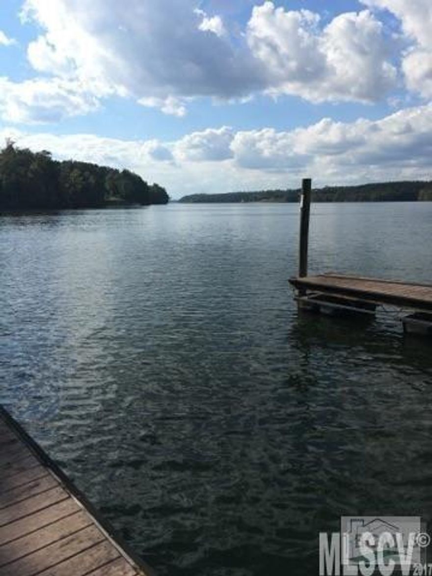 Unique lot on Lake Rhodhiss! Enjoy 5.15 acres and access to the lake and Nolden Creek (Island Creek) from this property, as well as deeded boat slip #92. Great building lot located in a park-like setting. The rear of the property backs up to a running creek which flows into one of the fingers of Lake Rhodhiss. Launch a kayak or canoe from your backyard! Enjoy the community park and picnic area with barbecue grills, wildlife, and all that lake living has to offer. Waterside Amenities include: • Paved Roads • Electronic Security Gate • Boat Slips • Underground utilities • Private Septic. Lake Rhodhiss Highlights: • 3,000 Acres in size • 90 Miles of shoreline • Regulated by Duke Energy • Fully Recreational Lake (Boating, Sailing, Jet Ski’s, Water Skiing, Swimming, etc.) • Fishing tournaments • Constant water level, clear water clarity • 6 boat launches.