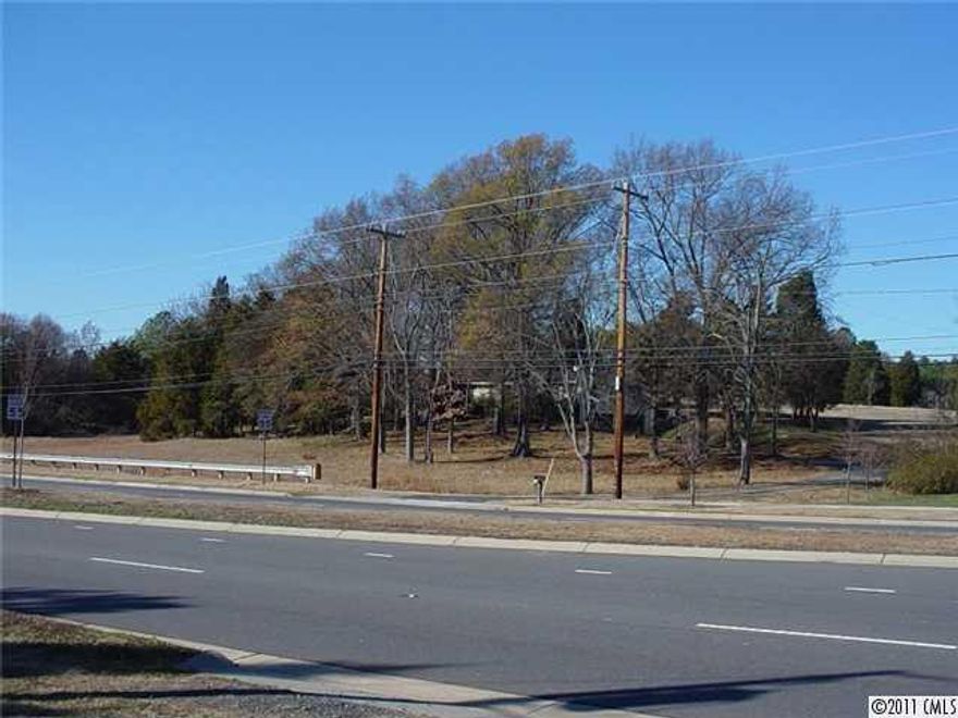 Almost 4 Acres w/380 feet of Hwy 49/Tryon road frontage, near the Intersection of Steele Creek Rd, and S. Tryon. City water/sewer available.  Zoned R-3 (single family residential). Other potential uses include, Adult & Family child care, Religious & Educ. institutions, government buildings, recreation centers and misc. Commercial and business applications subject to rezoning.