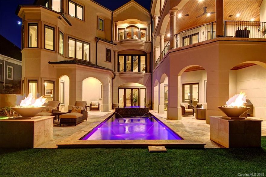 Exquisitely designed home offering perfect lifestyle for entertaining! Every detail thoughtfully considered throughout including the circular staircase w/ wood turret.  Stunning covered terraces offer main lake views. Linear Fireplaces (comm. grade), exotic granite, elevator, cutting edge theater & Control 4 system, walnut wd floors. The LL travertine flooring starting inside leads to the pool & deck area creating a seamless flow of stunning architecture. Fixed dock w/ boat & jet ski lifts.