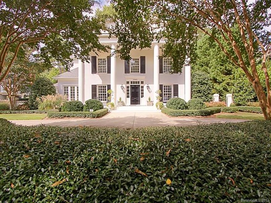 Beautiful 2-story white painted brick home situated on flat .74 acre lot in sought after Harris Rd. High ceilings & hardwoods down. Fabulous floor plan. Nice sized formals plus huge great room. Updated kitchen w/sunroom & breakfast room with a fireplace. Guest suite down, plus 4BR & 2BA up and bonus room. Master BR with nice size updated BA. Glass porch with gas grill overlooking beautiful flat backyard and 3-car attached garage.