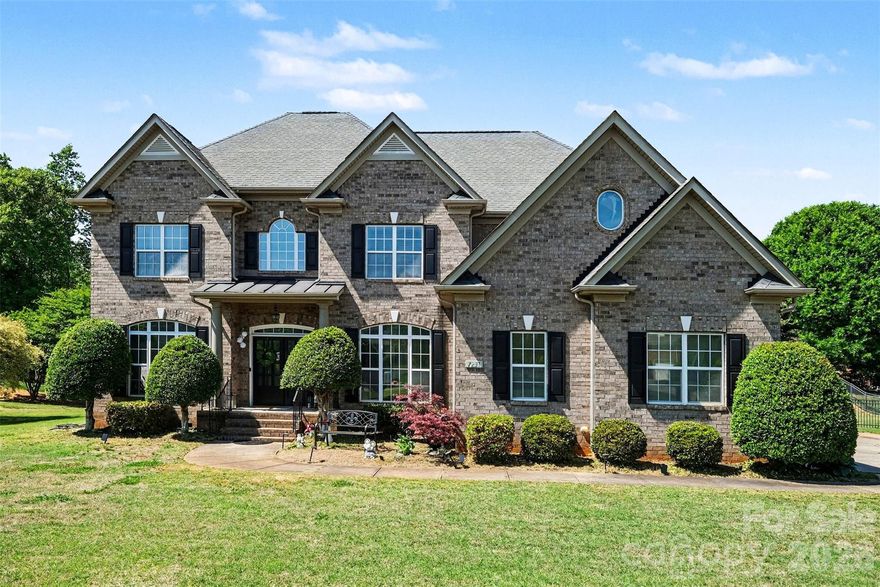 Welcome to this stunning, thoughtfully updated home in the desirable Ellington Farm community, where timeless design meets modern upgrades on a beautifully maintained lot. From the moment you arrive, the stately brick exterior, expansive driveway, and manicured landscaping create an impressive first impression that continues throughout the home.

Inside, you’re greeted by a grand two-story foyer with elegant trim work and a sweeping staircase, setting the tone for the refined yet comfortable living spaces beyond. The main level offers a seamless flow ideal for both everyday living and entertaining, with formal and casual spaces that feel open, bright, and inviting. Recently refinished flooring adds warmth and sophistication, enhancing the home’s natural light and cohesive design.

At the heart of the home, the fully updated kitchen is a true showpiece, featuring custom cabinetry, striking countertops, designer lighting, and an oversized island that anchors the space. It opens effortlessly to the living area, where large windows and a fireplace create a welcoming atmosphere for gathering. The dining spaces offer flexibility for both intimate meals and larger occasions, all framed by tasteful finishes and thoughtful details.

Upstairs, the spacious primary suite feels like a private retreat, highlighted by a beautifully renovated bathroom with high-end finishes, a freestanding soaking tub, and a large walk-in shower. Additional bedrooms are generously sized, and the updated bathrooms throughout the home reflect a consistent, elevated style. The third floor adds even more versatility, featuring brand new carpet and an expansive bonus area that can serve as a media room, playroom, or additional living space.

Step outside to enjoy the covered rear porch overlooking a large, open backyard that offers endless possibilities for relaxation and entertaining. Whether hosting gatherings or enjoying quiet evenings, this outdoor space provides the perfect backdrop.

Located in Mint Hill, this home offers the best of both worlds with a peaceful, established neighborhood feel while still being close to shopping, dining, and everyday conveniences. With its extensive updates, spacious layout, and beautiful setting, this home is truly move-in ready and designed for comfortable, elevated living