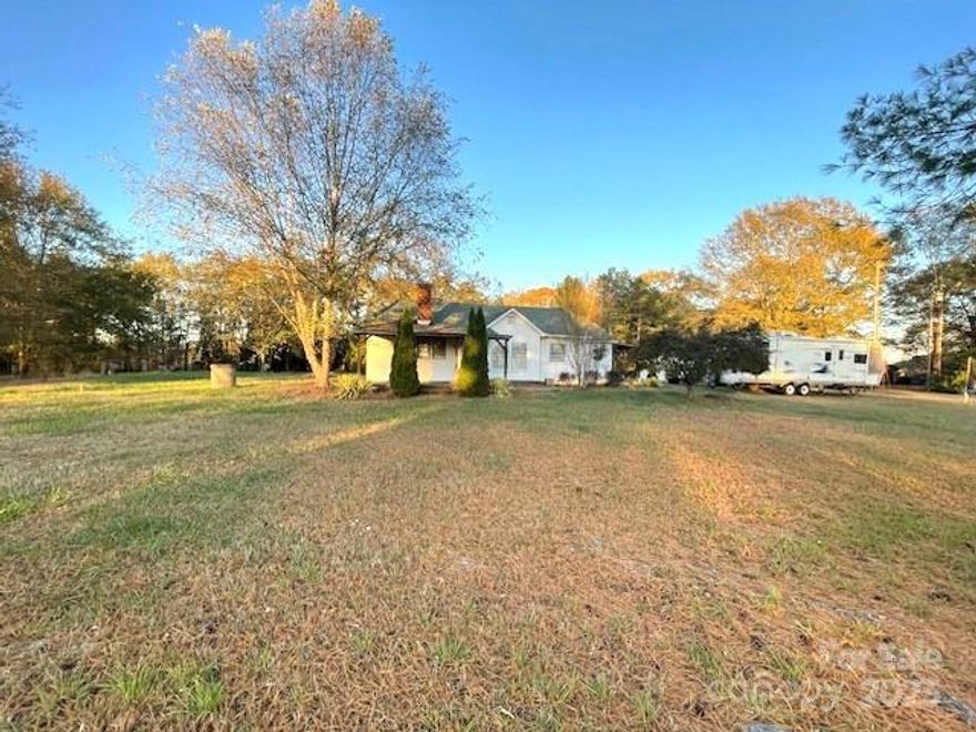 Rustic charm is what you will find in this 2 bedroom 2 bath home that sits on over 2 acres and offers the outdoor space of your dreams.  Custom cabinets in the kitchen, dining room and bar area, along with custom wood working throughout the home from the kitchen to the primary bedroom with the wood accent wall and an electric wall fireplace to the wood ceilings and cathedral style in some rooms.  A child's play house/bed can be found in the second bedroom and wooden chair railing found throughout the house.  Outside, you will find not one but two workshops ready for whatever hobby or business you might want to start.  Land is level with useable space all around.  Added patio pavers and an above ground pool with an arbor for entertaining.  Some tlc needed but priced to move.  Close to 74 bypass to Shelby or South Carolina and ease of access to Rutherford County areas as well.