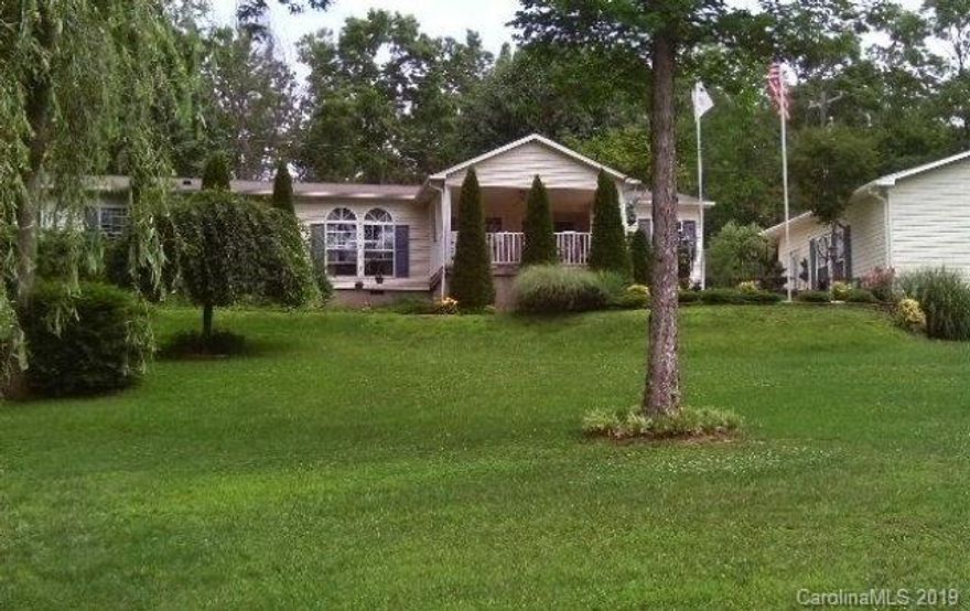 This is a 3BR, 2BA home that shows like a brand new home; a large living room formal dining room combination with wood fireplace: and eat in kitchen. Owner cared for this home over the years and it is reflected in it's immaculate condition and amenities. For example, the home has a heat pump, laminate floors, appliances are 2 yrs old, built in sound system, fenced back yard, sidewalks to kennel and outbuilding, 21x18 storage building, 24x24 double car garage with concrete floor, and paved drive and parking.  You'll marvel at the finely manicured lawn, and lovingly cared for landscaping. Call to make an appointment for your private showing.