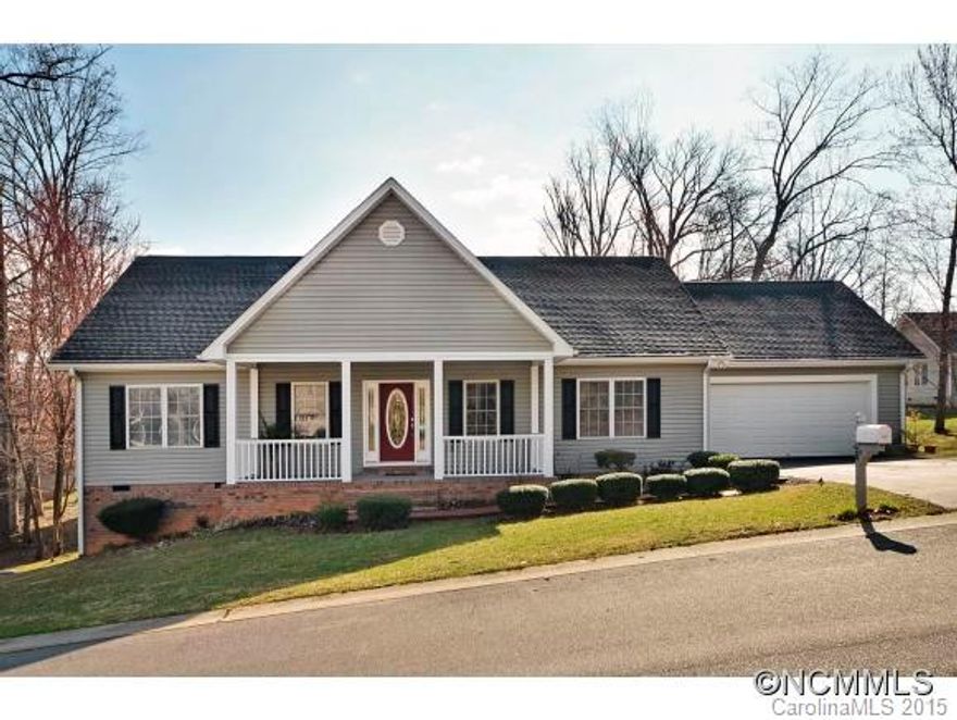 One level living in beautifully maintained 3BR, 2BA home in the Holcombe Woods neighborhood of Candler.  Inviting covered front porch, hardwood floors, crown molding, gas fireplace with granite surround, spacious kitchen with granite counters, Maytag stainless steel appliances including convection double oven, large owners suite with walk-in closet & tile bath, split bedroom plan. A must see. Home shows perfectly.  Includes a one year warranty.