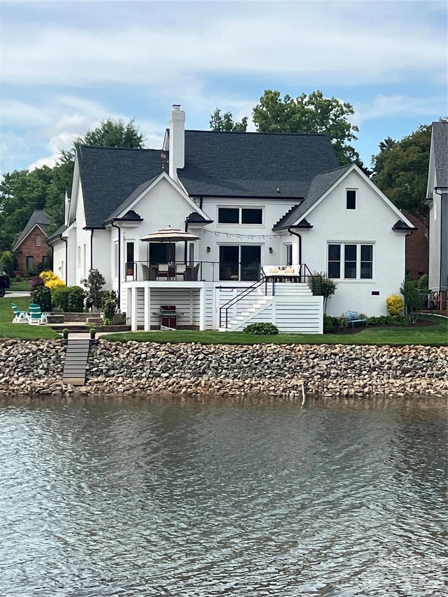 Exceptional waterfront gem in Cornelius under $2.2M. This well-maintained and recently updated home features 5BD/5BA providing the ultimate blend of luxury, convenience, and lake charm.  Conveniently located to nearby Birkdale dining and shopping, downtown Charlotte and the airport. Step inside the dramatic two-story great room complemented by a floor to ceiling book-matched porcelain fireplace, where windows fill the freshly 
painted home with abundant natural light.  Relax in your 4-season sunroom while taking in unobstructed captivating lake vistas and sunsets. Designed for effortless lake living and entertaining, the beautifully updated gourmet kitchen shines with quartz countertops and large center island, sleek custom cabinetry, ILVE professional gas range, stainless appliances, lighted wine wall, coffee and beverage bar, perfect for cooking and entertaining. Desirable primary suite on the main level offers convenience and accessibility, 
with an expansive walk-in closet with center island.  An additional main level bedroom provides flexibility for a home office, guest room or study. The open-concept living of this waterfront home seamlessly connects to 
outdoor living space for relaxing and entertaining on its expansive deck, paver patio with a built-in fire pit, or a covered lower patio embodying serene lakefront elegance. Complete with a deeded boat slip just steps away, providing effortless access to water recreation, nearby to a community pool, tennis and pickleball court. 
Don’t miss this rare opportunity to own a waterfront paradise in one of Cornelius’ most sought-after lakefront locations.