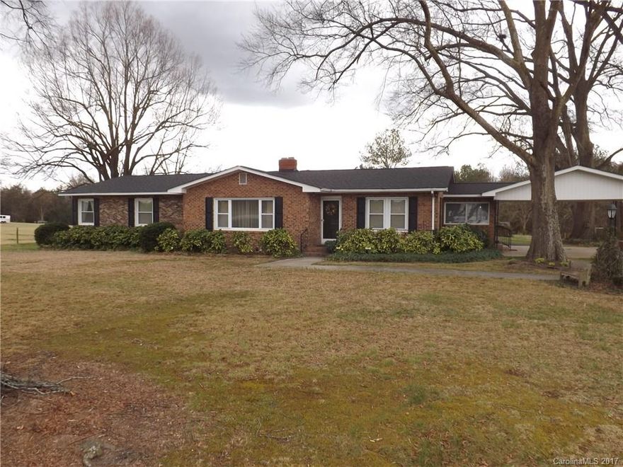 Wonderful home in the country! This one owner home has been carefully maintained through the years. Large oak tress shade the large lawn. Family room, kitchen and dining is an open floor plan. The living room is in immaculate condition and may have hardwoods under the almost new carpet. Very large master bedroom and bath was added in the mid 60's. Master bath was recently remodeled.  Sun room on the back has a wood burning fireplace. You will not be disappointed with this property.