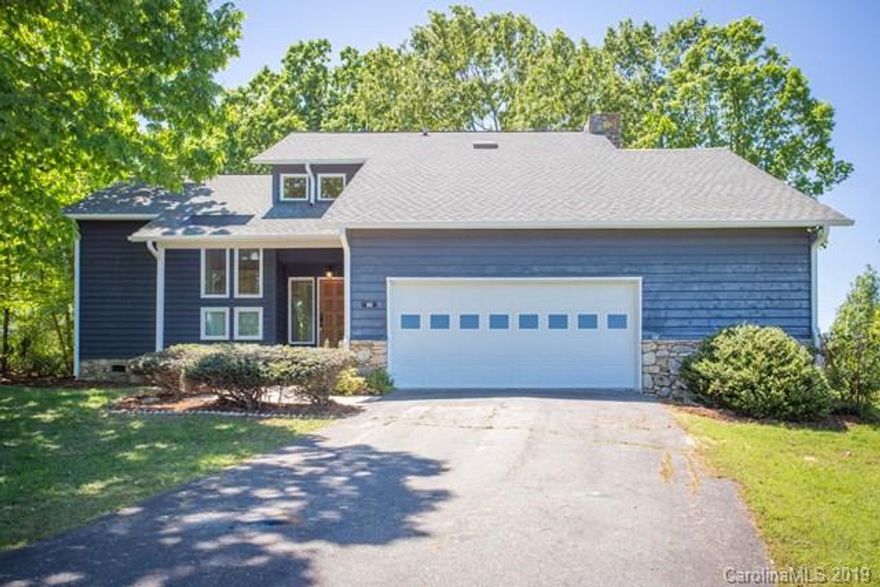 Golf, Lake and Mountains!  This is your headquarters for fun and relaxation!  Located on the 12th hole of the only lakefront golf course on Lake James!  Views of golf course from the backyard and views of Lake James from the front yard-- this home has something for everyone in your family!  Gorgeous, light-filled contemporary home has hardwood floors throughout. Main floor offers sunken living room with vaulted ceiling, skylight, formal dining room, keeping room off the kitchen with cozy gas fireplace and wet bar.  Bonus room can be used as a study or extra room for guests and a half bath--all on the main level.  Upstairs offers 2 bedrooms, full bath and large master suite that opens to expansive upper deck with stunning views of Lake James, large private bath with garden tub, separate shower and skylights.  Wrap around deck w/lake views.