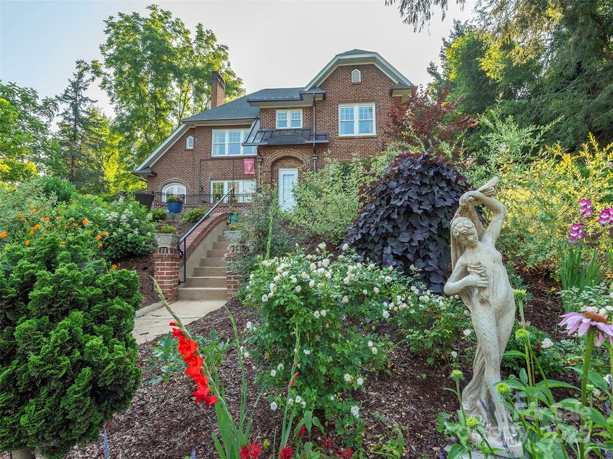 Exceptional Value~ Priced to sell and in excellent, turn-key condition. Sellers relocated, and now is your opportunity to own a gorgeous Grove Park beauty with every system updated. Even the most scrupulous buyer can rest assured with a new roof, all new plumbing, electrical updates, a modern boiler system, and dual-zoned central AC and heat pumps. Gorgeous new copper gutters gleam above a garden so striking and lush that the Red Trolley tour stops out front in admiration! The elevated lot provides stunning city views, while the terrace features renovated guest quarters with two separate entrances—perfect for a home office, visitors or a lucrative turnkey, furnished rental generating immediate returns (financials available upon request.) Charm abounds here with dramatic archways, art deco custom details and fabulous 1920s fixtures. Only 5 minutes to Downtown Asheville, this is your chance to own a piece of North Asheville history with every detail perfected for modern living.