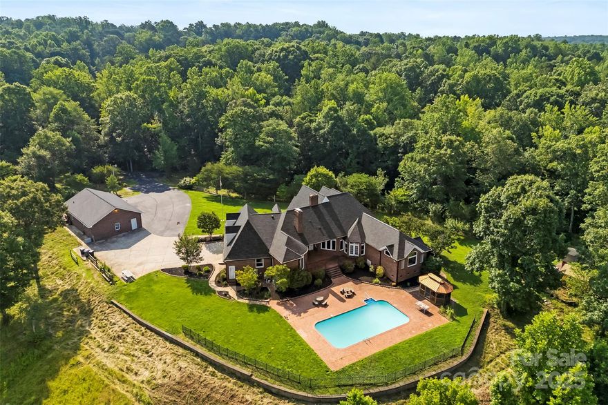 Welcome to your private retreat—this custom-built brick home is nestled on nearly 56 sprawling acres of pristine land. Designed for both luxury living and outdoor adventure, this remarkable property features high-end finishes throughout, including a gourmet kitchen perfect for entertaining. Enjoy the expansive outdoor space with an inground pool, multiple detached garages/ workshops, and a meandering creek running through the property. Whether you’re hunting, fishing, or simply enjoying the peace of nature, this estate is a rare opportunity to own a truly unique and secluded haven. Property has a 4th flex space with window and closet/ septic is rated for a 3 bedroom.