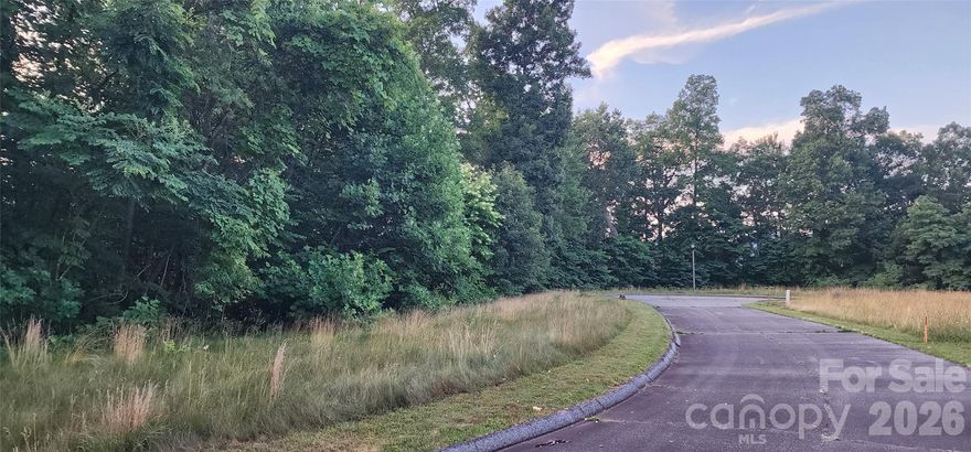 Discover a spacious building lot in the prestigious Campbell Mountain Estates, complete with a valid three-bedroom permit through April 2028. There are also underground utilities and access to city water (tap fee required).  The seller is willing to share building plans with an attractive offer. Seize the opportunity to construct your dream home in Waynesville, conveniently located just minutes from I-40, Downtown Waynesville, and Maggie Valley.