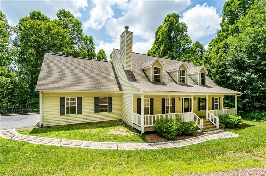 Enjoy peace and quiet from your covered rocking chair front porch! Beautiful location where wildlife abounds. Built in 2007 this 3/2.5 home features a master on main floor with huge walk in closet, attached garage, open sunny rooms and tons of storage. Large living room with stone fireplace, and wood floors, open floor plan to kitchen and sliding glass doors/large windows to back deck for maximum light. Move in ready condition. Come by and see this one!