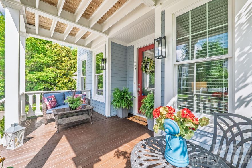 Southern charm meets the Baxter Village lifestyle in the River District.
Enjoy a more private setting in Baxter Village at 809 Elswick Court, tucked on a cul-de-sac off New Gray Rock Road with a wooded backyard and access to the Carolina Thread Trail system leading toward the Catawba River and Catawba Park.

From the blooming magnolia trees to the cheerful front door and THREE welcoming porches, this home captures the warmth and character of Fort Mill living. A grand double-porch entry opens to a beautiful foyer with hardwood floors throughout the main level and stairs.

With over 2,500 sqft, this home offers 4 bedrooms, 2.5 baths, a spacious kitchen with abundant cabinetry, generous counter space, and an eat-in bar that opens to the family room. The screened porch overlooks the private wooded backyard—perfect for relaxing, entertaining, or enjoying Southern sunsets from a rocking chair.

The primary suite features tray ceilings, a lovely bath with separate soaking tub, and his-and-her walk-in closets. Two secondary bedrooms, including one currently used as an office, have access to the front balcony porch. Well-cared for and loved, newer hot water heater and AC unit replaced in July 2023!

Nestled between Catawba Park and Baxter Town Center, this home offers full access to Baxter Village amenities, including 2 pools, clubhouse, tennis courts, miles of trails, community events, shops, restaurants, and beloved neighborhood traditions.

More good news: SCDOT has proposed a 10-foot shared-use path along New Gray Rock Road for pedestrians and bicyclists, extending from Stratford Run Drive to Tega Cay’s Catawba Park and connecting with existing trails.

Southern charm, endless amenities, award-winning Fort Mill Schools, and convenient access to I-77 and Kingsley—Baxter Village has it all.
