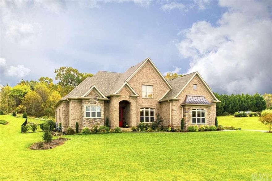 Priced below tax value on almost an acre in Moore's Ferry! From the soaring ceilings in the great room to the gleaming hardwoods you will adore the design and features of this home. Elegance and comfort abound throughout this meticulously maintained home only three years old. The open kitchen with granite countertops, stainless steel appliances and two pantries will delight any gourmet chef. A sunny breakfast area and an elegant dining room with coffered ceiling as well as a covered outdoor patio and huge fenced back yard are ideal for entertaining family and friends. The luxurious main level master suite offers a trey ceiling, large walk-in closet and fabulous master bath with double vanities, a jetted tub, large tiled shower and tile flooring. An office or fifth bedroom, a laundry room and full bath complete the main level. The upper level has three more bedrooms, a large bonus room and another full bath and half bath. Central vacuum and Rinnai tankless gas water heater included.