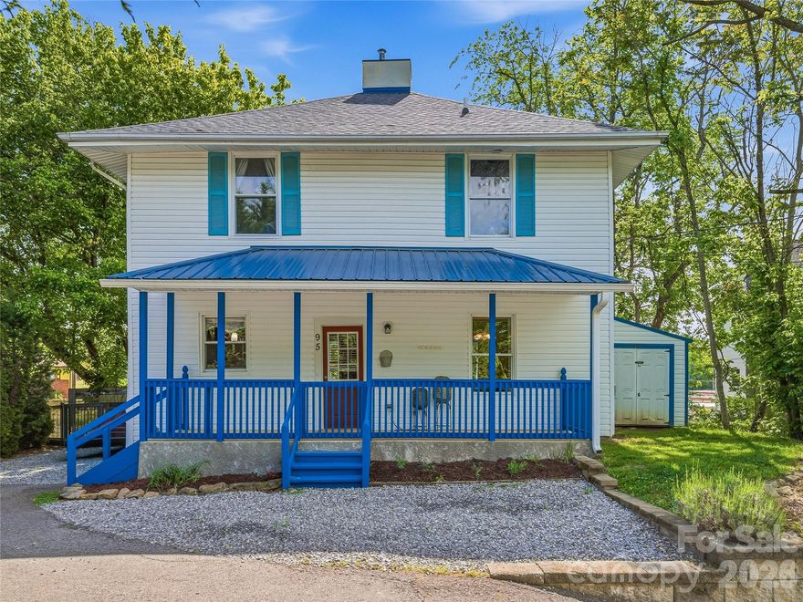 Some homes are built. This one was born — in 1910, on a corner lot in the heart of West Asheville, where the streets still hum with the kind of energy that makes people fall in love with this city in the first place.  
Step through the covered front porch and into a foyer that opens to a home completely reimagined for modern living while honoring over a century of character. Original wood floors ground each room in warmth and history, while the stunning open kitchen — granite countertops, stainless steel appliances, tile backsplash, and a center island with breakfast bar — delivers the kind of space where Sunday mornings last all afternoon.
The main level flows effortlessly from the formal dining room through the living areas, with a convenient half bath tucked off the foyer. Upstairs, three bedrooms include a primary suite with a walk-in closet featuring built-in shelving and a full en-suite bath. A second full bath and upstairs laundry keep daily life simple.
Outside, the fully fenced backyard is a private retreat — level, green, and ready for the gardner in you and two sheds offering workshop and storage space. The covered rear porch connects indoor and outdoor living seamlessly.
Situated just blocks from Haywood Road's beloved breweries, restaurants, and local shops, this home puts the best of West Asheville right at your doorstep — with downtown just minutes away and I-26 a quarter mile out. Schedule your private tour today.