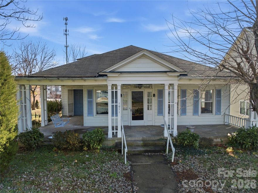 Charming historic building featuring tall ceilings, double French doors, wood floors, a welcoming front porch, and a fireplace. Zoned B-3 for flexible use—business/office, single-family, or multifamily residential. Includes 3 bedrooms, 2 bathrooms, and a full basement. Home requires significant repairs, but plumbing and HVAC are functional. Recent inspection available and ready for the right buyer’s vision. Some photos are enhanced to show how the floors could look after refinishing.