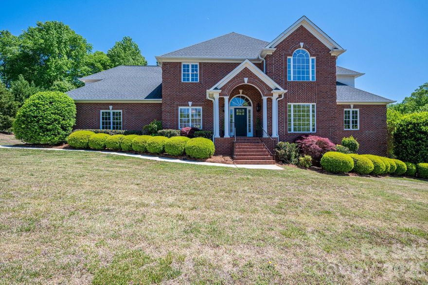 Nestled in the elegant community of Pinsto Forest in Belmont, this beautifully remodeled 5-bedroom, 3.5-bath brick home offers a perfect blend of timeless character and modern luxury. Refinished hardwood floors extend throughout both the main and second levels, creating a seamless and elevated feel from top to bottom.

Designed for both everyday living and entertaining, the home features a thoughtful, spacious layout filled with abundant natural light. The living room is especially impressive, with ceilings that open to the second floor, creating a bright, airy feel and a true sense of scale. The primary suite is privately situated on its own wing of the home, offering that highly desired sense of separation and comfort. It is further enhanced by a fully renovated bathroom that serves as the showstopper of the home with its spa-like design and upscale finishes. A secondary staircase adds convenience and functionality to the home’s overall flow.

Outdoor living is where this property continues to shine. A deck spanning the entire rear of the home overlooks a private backyard oasis and includes a screened-in sunroom for year-round enjoyment. Below, a covered patio provides direct access to the unfinished basement—complete with a convenient bathroom—perfect for rinsing off after a day in the heated and chilled pool. The outdoor space is further enhanced by a fireplace and grilling station, creating the ultimate setting for relaxation or entertaining in a private, serene environment.

Adding even more value and opportunity, the home features over 2,000 square feet of framed, unfinished basement space—offering endless potential for expansion, storage, or customization to fit your needs.

This is a rare opportunity to own a move-in ready home in one of Belmont’s most desirable communities, offering space, style, and exceptional indoor-outdoor living.