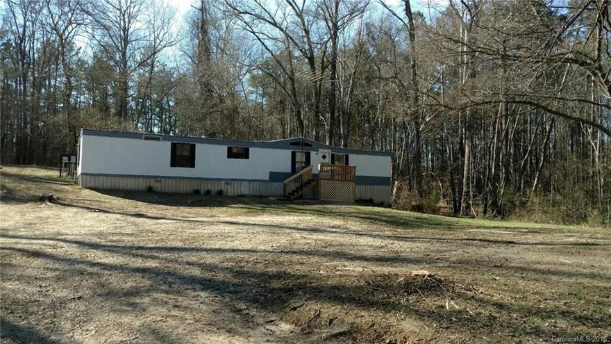 Nice single-wide mobile home with three bedrooms, two full baths, on two acres of land.  Great starter home.  Needs just a little TLC.