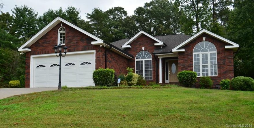 Get ready to say 'WOW' when you open the front door to this stunning all brick home! Designer inspired color and architecture, gleaming maple hardwoods, beautiful tile flooring w/custom granite inserts, 42" Sony Television cradled in a custom built wall cabinet, Kitchen with granite & tile backsplash, Dining area w/peninsula fireplace, Stunning Jacuzzi tub...just to name a few! All nestled on a private wooded lot! You will be speechless after seeing this one, WOW!! 1 Year Home Warranty included!