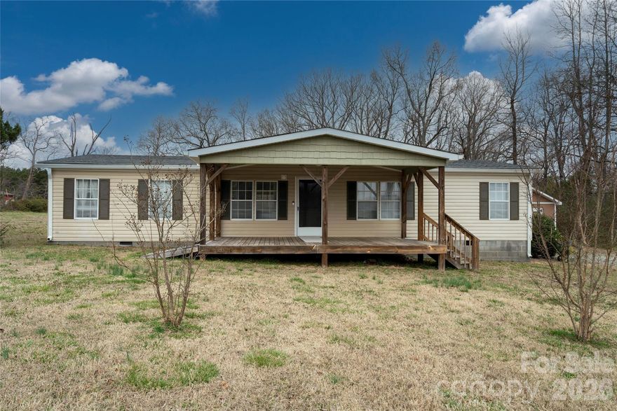 This 3 Bedroom two bath home sits on almost 2 acres. House has new carpet in 3 bedrooms and some new paint. Roof and HVAC less than 7 years old.  Home offers large front porch and a back deck for entertainment.  This house sits off the road for privacy and is located close to the interstate for easy access to Concord, Charlotte, or Salisbury.  The yard features two outbuildings for storage and plenty of recreation area. Property has been inspected by Structural Engineer and will go FHA, USDA, or VA but will be sold AS-IS.  Home also has had Septic inspection. Schedule your appointment today!!!